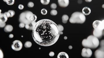 Abstract depiction of multiple water bubbles floating against a solid dark background creating an intriguing visual display. photo