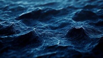 Waves ripple across the dark blue water, creating intricate patterns and textures. The ocean's surface is a mesmerizing display of nature's beauty. photo