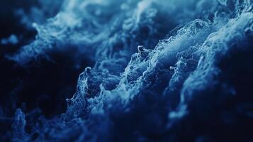 Abstract blue waves crashing with textured movement. Evokes depth and mystery, dynamic flow and visual texture. Mesmerizing sea scene. photo