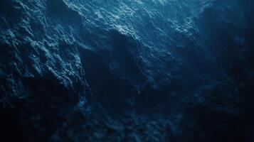 Deep ocean waves cresting in a textured pattern, dark water surface with unique formations. The sea's powerful, natural design is captured. photo