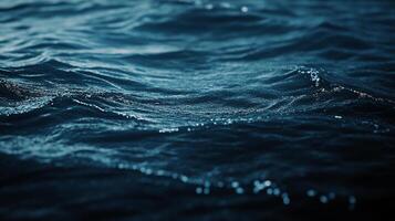 Blue ocean waves with sunlight glimmering on the surface, creating a serene and peaceful sea scene, reflecting the sky above. photo