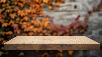 Autumn backdrop with a blank wooden shelf, perfect for displaying products, crafts or decorations in front of vibrant fall foliage. photo