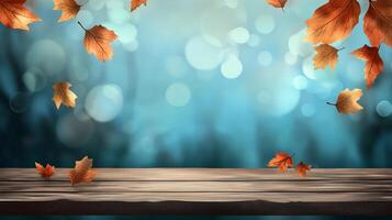 Autumn leaves gently falling on a serene wooden surface, creating a tranquil and inviting atmosphere. Background of shimmering blue light. photo