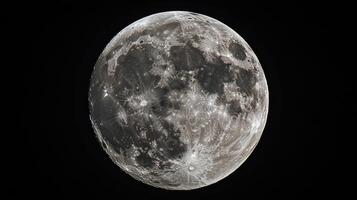 Detailed shot of the moon, showcasing its craters and textures against the inky blackness of space. photo