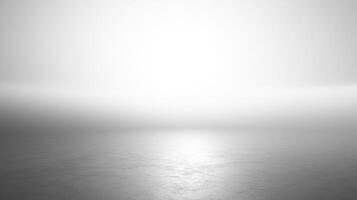 This ethereal monochromatic landscape features a soft grey gradient with a gentle glare, creating a dreamlike atmosphere that invites contemplation and tranquility. photo