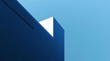 A striking image of geometric blue architecture set against a bright blue sky, highlighting the contrast between structured design and the expanse of nature. photo