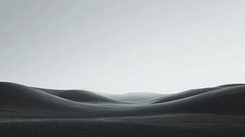 A stunning black and white landscape captures gentle hills rolling into the distance, evoking feelings of calmness and introspection in a serene environment. photo
