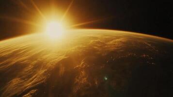 Sunrise viewed from outer space showcasing the Earth's curvature, clouds, and atmosphere with sunlight glinting off of everything. photo