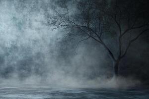 Eerie and misty night scene with a bare tree silhouetted against a dark, atmospheric background. The fog adds to the spooky feeling. photo