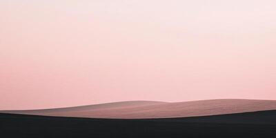 Minimalist landscape with soft pink sky over rolling fields, showcasing a serene and abstract composition of color and form. photo