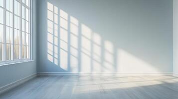 Bright, airy interior featuring sunlight streaming through a window, creating interesting shadows on the wall and reflecting on the wood floor. photo