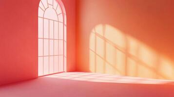 Sunlit peach room featuring an arched window casting striking shadows across the floor, creating a warm and inviting atmosphere. photo