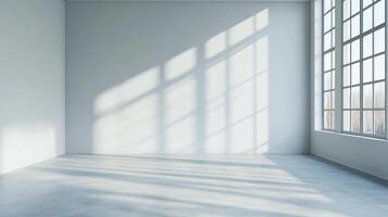 Sunlight streams into an empty room through a grid of windows, casting patterned shadows across the walls and floor. photo