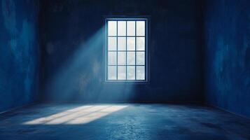 Monochromatic room lit by a beam of light shining in through a window, creating a serene and contemplative atmosphere. photo