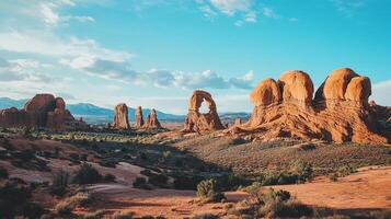 Majestic desert landscape featuring red rock formations under a vast blue sky with scattered clouds. A scenic and arid environment. photo