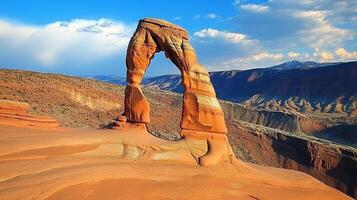 Majestic sandstone arch in the desert. Against a backdrop of distant mountains and sky, a geological wonder stands as a testament to nature's power. photo