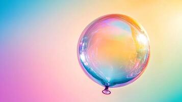 A mesmerizing iridescent balloon drifts against a dreamy gradient background, casting soft, multicolored reflections in this artistic shot. photo