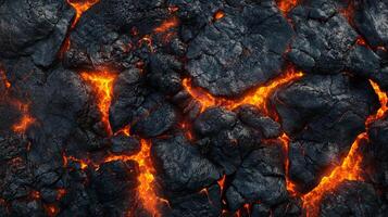 Molten rock seeps through cracks in cooling lava. Fiery orange contrasts with dark volcanic rock in this abstract geological display. photo