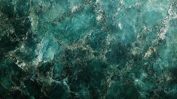 Intricate patterns in shades of emerald green and dark teal create a textured stone surface. The surface showcases depth and complexity. photo