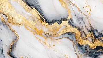 Elegant marble texture with dynamic gold, gray, and white swirls creates a luxurious and sophisticated aesthetic. Ideal for backgrounds. photo
