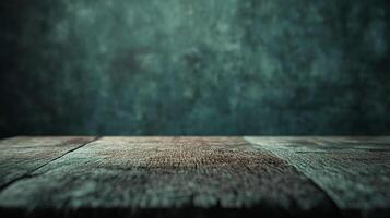 A rustic wooden surface with a muted green backdrop, creating a natural and textured scene. The weathered wood is the focal point. photo