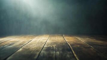 Wooden planks in the foreground lead to a foggy, dark backdrop. A single light source illuminates from above, creating an ethereal mood. photo