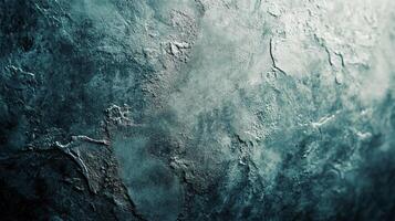 Abstract textured background in shades of deep blue and light grey, resembling a rocky surface or planetary terrain. photo