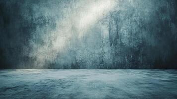 Abstract background featuring a distressed cement floor and wall. Light falls across the surface, enhancing the textured look. Cool tones present. photo