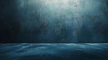 A blue-toned scene featuring a textured wall meeting a similarly textured floor, suggesting a studio setting with moody lighting for product display. photo