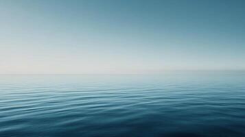 Serene ocean view, featuring calm blue waters meeting a pale sky horizon, creating a peaceful and contemplative atmosphere. photo