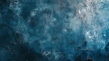 Textured blue background with a gradient, showing a mix of dark and light shades, evokes feelings of depth and serenity in abstract. photo
