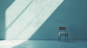 A wooden chair sits in an empty room, illuminated by a beam of sunlight streaming through a window, creating a serene atmosphere. photo