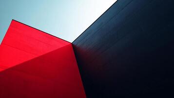 Abstract architecture with bold lines and contrasting colors. A modern design featuring red and blue with stark angles against a clear sky. photo