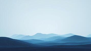 A serene ocean landscape of softly graded, undulating blue hills beneath a pale sky creates a calming and vast visual experience. photo