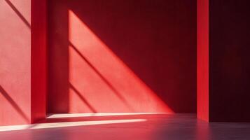 A striking image of a red room bathed in light, creating sharp contrasts and geometric patterns on the walls and floor. Minimalist design. photo