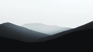 Serene mountain landscape in grayscale, with misty peaks creating a peaceful and minimalist scene. Perfect for contemplation. photo