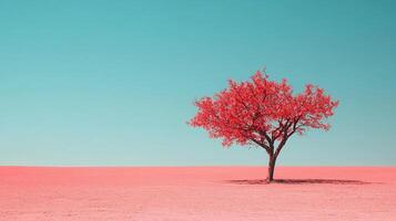 Solitary red tree standing alone against a clear blue sky, offering a striking contrast and a sense of tranquility in the minimalist landscape. photo