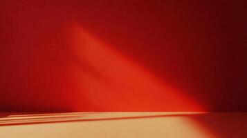 Abstract red wall and floor bathed in sunlight, creating shadows. Minimalist backdrop with warm tones and clean lines for product showcase. photo