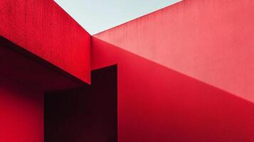 Geometric architectural details, walls intersecting, creating shadows and depth. Red and dark space. Modern building design. photo