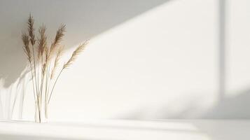 Elegant arrangement of dried reeds in a minimalist vase, bathed in soft, natural light, perfect for a serene, neutral aesthetic. photo