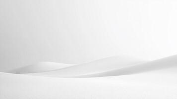 A minimalist landscape of undulating, pristine white dunes evokes feelings of tranquility and serenity in a monochromatic setting. photo