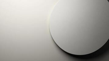 Abstract minimalist composition with a round, geometric shape set against a gradient neutral background in light gray tones. photo