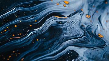 Abstract flow of blues, whites and darks. Tiny golden dots add depth to the liquid waves, creating a unique and calming visual experience. photo