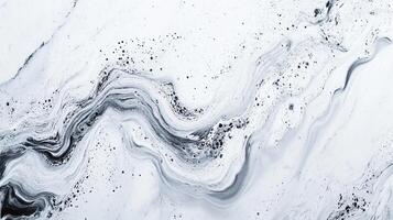 Black and white marble-like texture with swirling patterns and scattered specks creates an organic, abstract design. photo