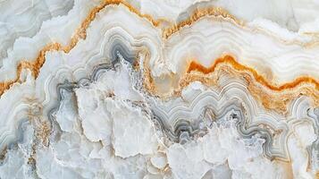 Detailed close-up of banded Onyx stone texture featuring wavy layers of whites, grays, and orange creating an organic, natural pattern. photo