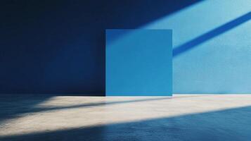 Geometric composition of a blue block in a room. Sunlight is shining on the floor and walls, creating shadows and highlighting textures. photo