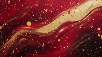 Swirling textures of red hues with gold accents, glittering sparkles and wave-like formations make this eye-catching fluid abstract. photo