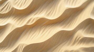 Golden desert dunes texture, rippled by the wind, creating beautiful patterns. The sun casts soft shadows, adding depth to the landscape. photo