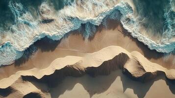 Aerial view of rolling sand dunes meeting the ocean waves, showcasing the dynamic intersection of desert and coastal landscape. photo