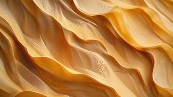 Abstract aerial view of sand dunes in a desert landscape. The golden hues and textured surfaces create a sense of calm. photo